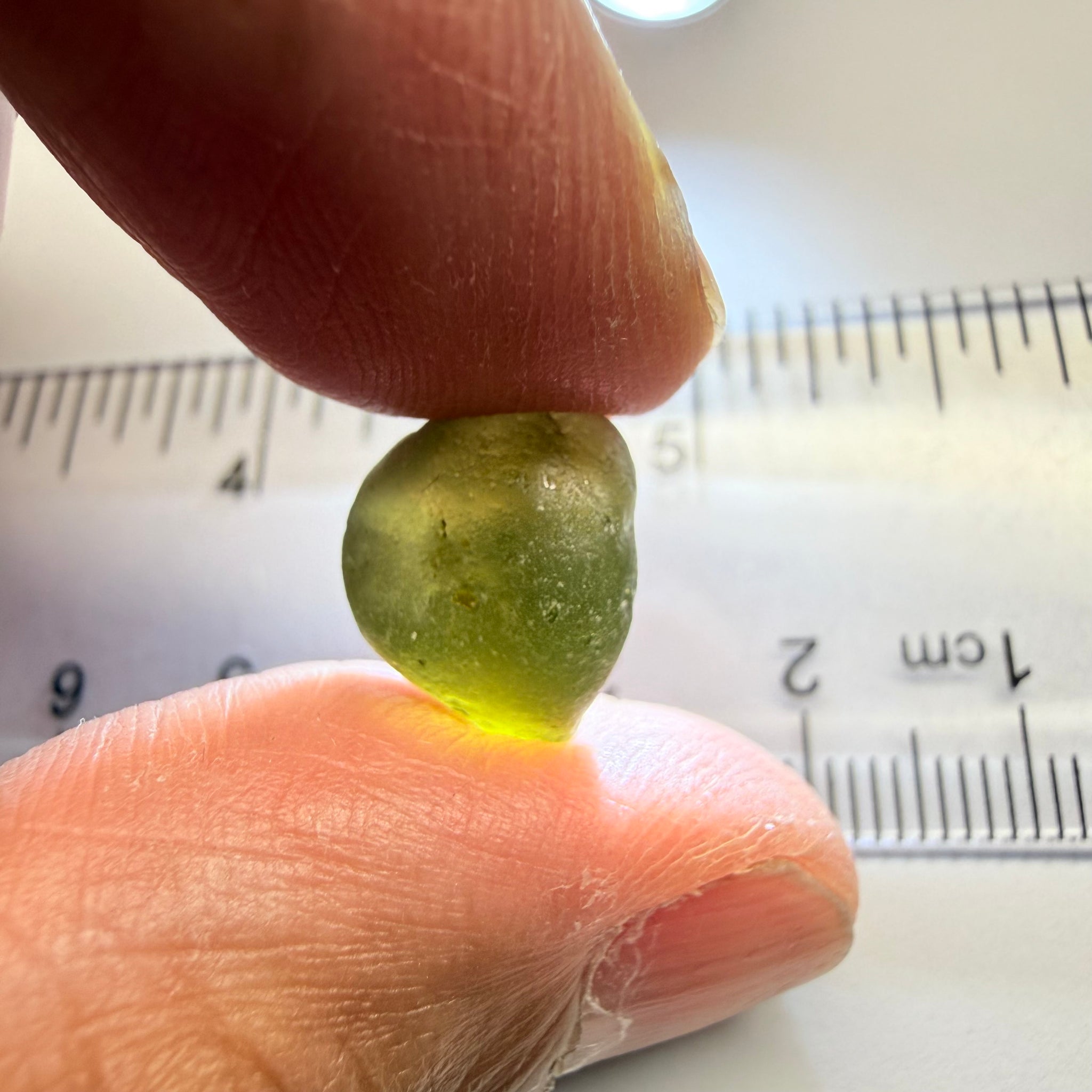 Green Brown Zircon, 12.07ct, Tunduru, Tanzania, Untreated Unheated, vvs-if with the characteristic haze in them found in green zircons from that location