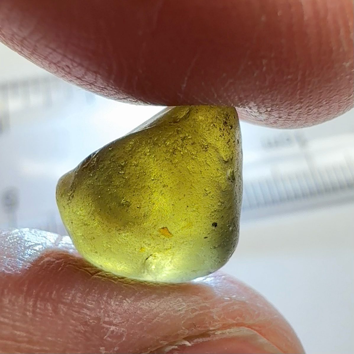 Green Brown Zircon, 12.07ct, Tunduru, Tanzania, Untreated Unheated, vvs-if with the characteristic haze in them found in green zircons from that location