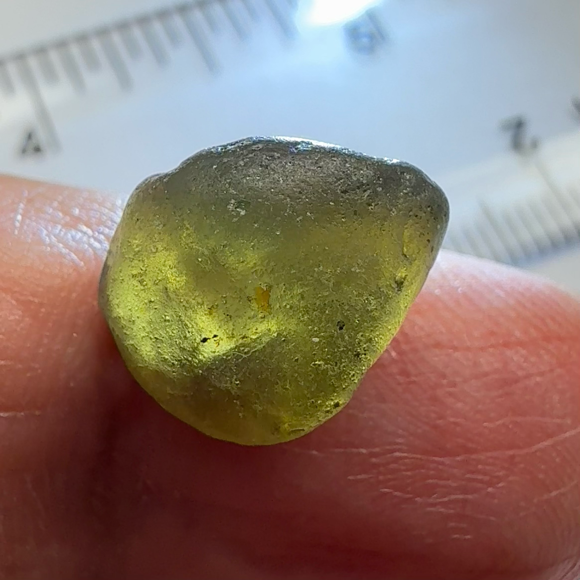Green Brown Zircon, 12.07ct, Tunduru, Tanzania, Untreated Unheated, vvs-if with the characteristic haze in them found in green zircons from that location