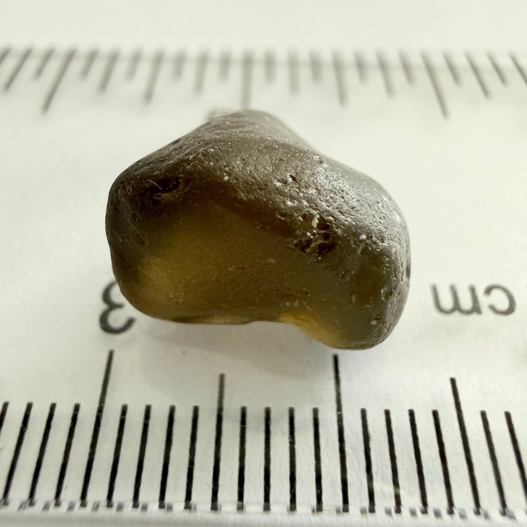 Green Brown Zircon, 12.07ct, Tunduru, Tanzania, Untreated Unheated, vvs-if with the characteristic haze in them found in green zircons from that location