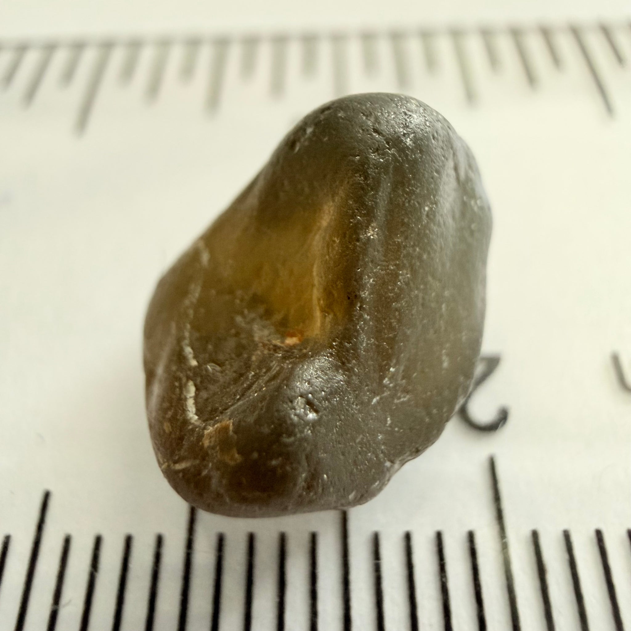 Green Brown Zircon, 12.07ct, Tunduru, Tanzania, Untreated Unheated, vvs-if with the characteristic haze in them found in green zircons from that location