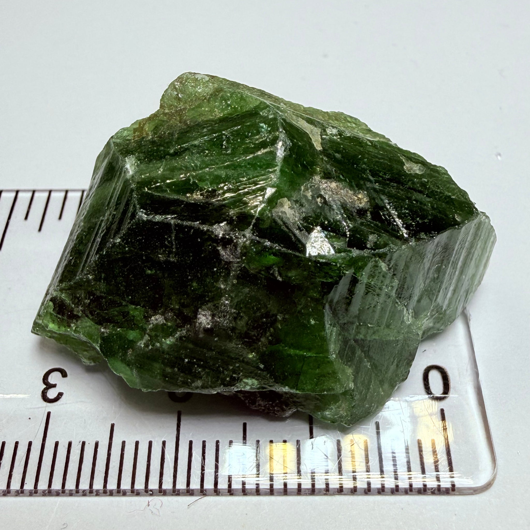 Tsavorite Crystal, 19.90gm / 99.50ct, Merelani. Tanzania, only the front is crystalized, but make a great specimen or set it in jewellery as is