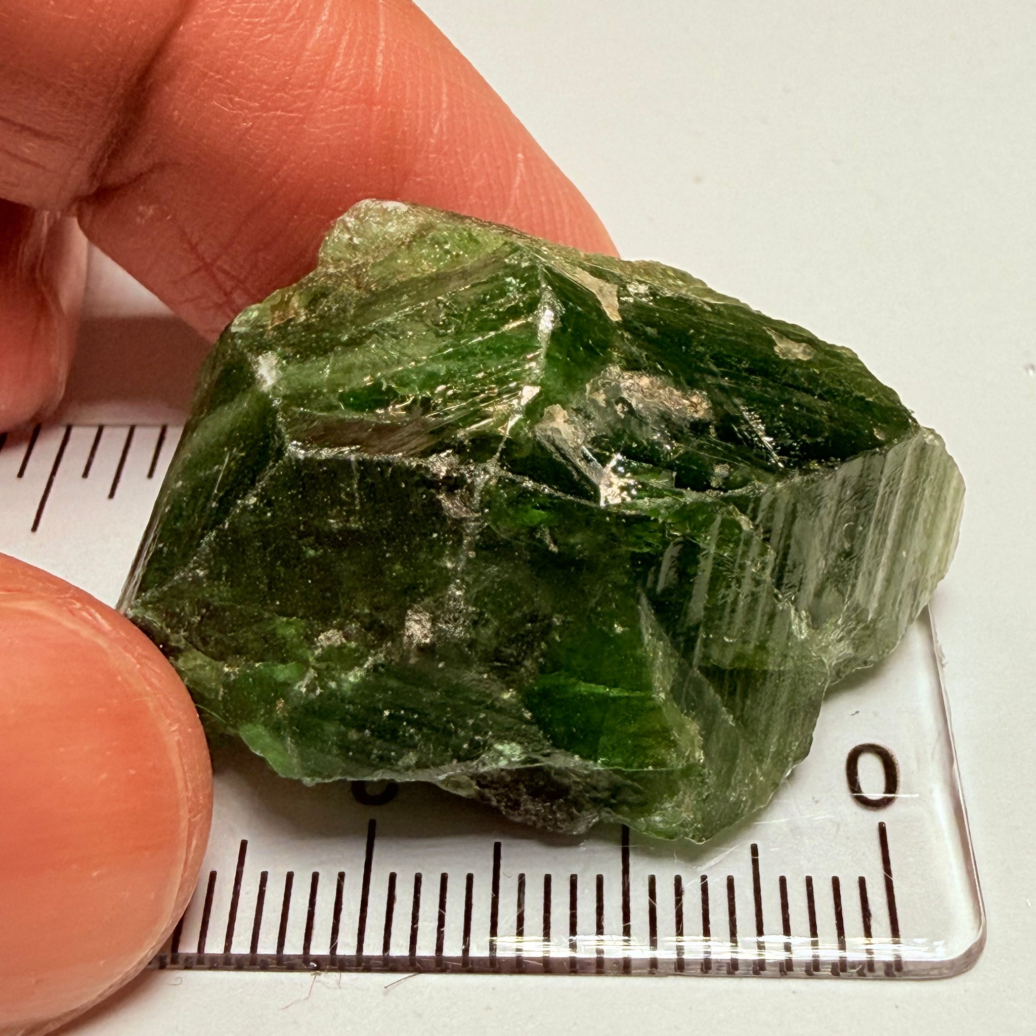 Tsavorite Crystal, 19.90gm / 99.50ct, Merelani. Tanzania, only the front is crystalized, but make a great specimen or set it in jewellery as is