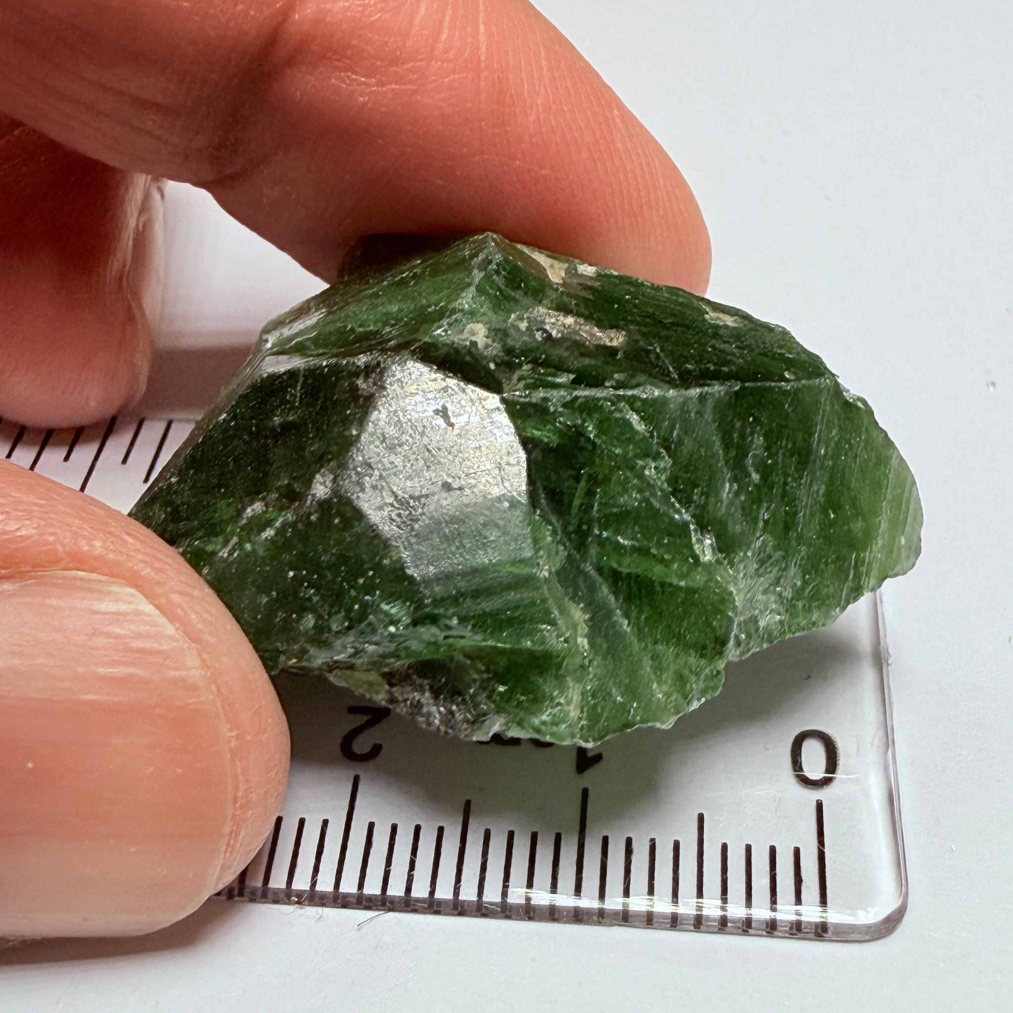 Tsavorite Crystal, 19.90gm / 99.50ct, Merelani. Tanzania, only the front is crystalized, but make a great specimen or set it in jewellery as is