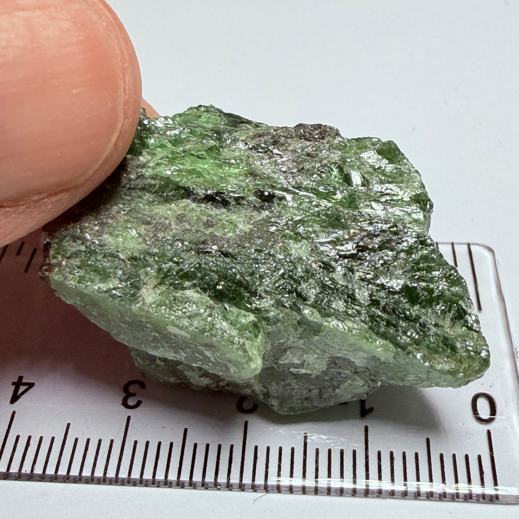 Tsavorite Crystal, 19.90gm / 99.50ct, Merelani. Tanzania, only the front is crystalized, but make a great specimen or set it in jewellery as is