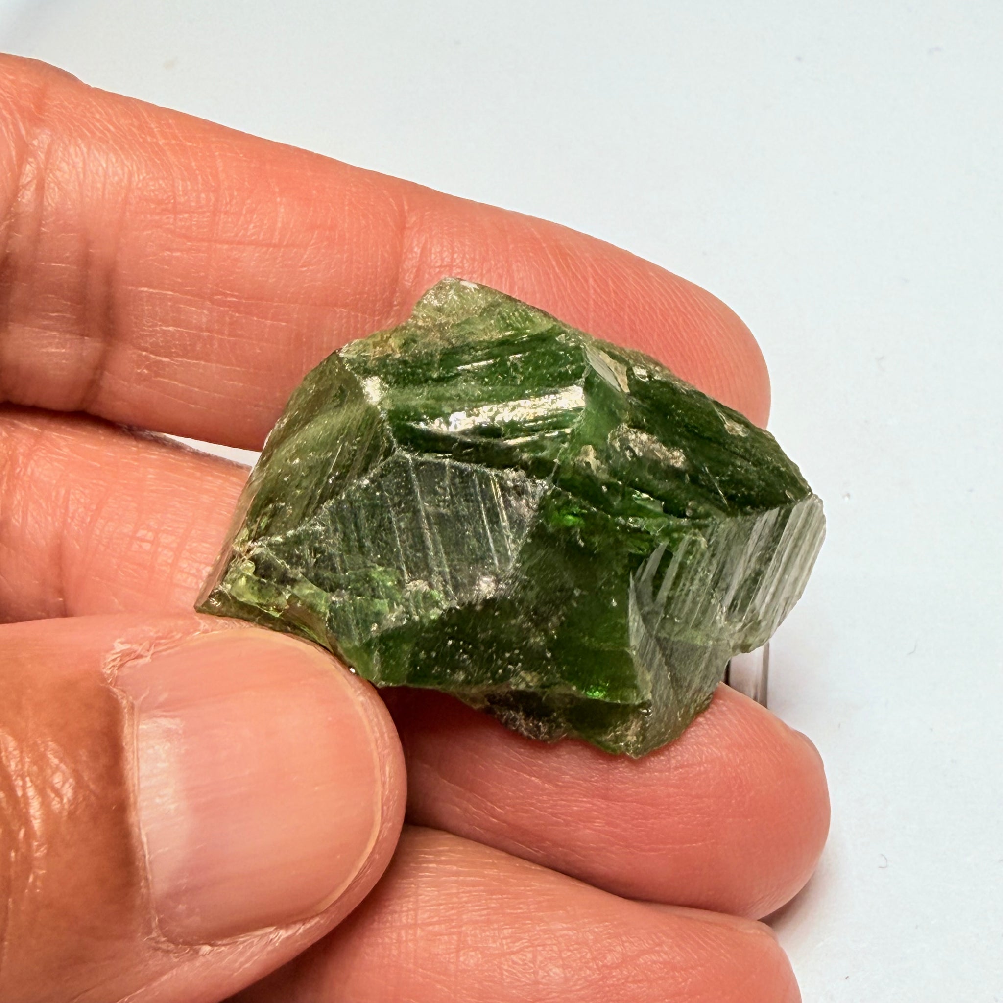 Tsavorite Crystal, 19.90gm / 99.50ct, Merelani. Tanzania, only the front is crystalized, but make a great specimen or set it in jewellery as is