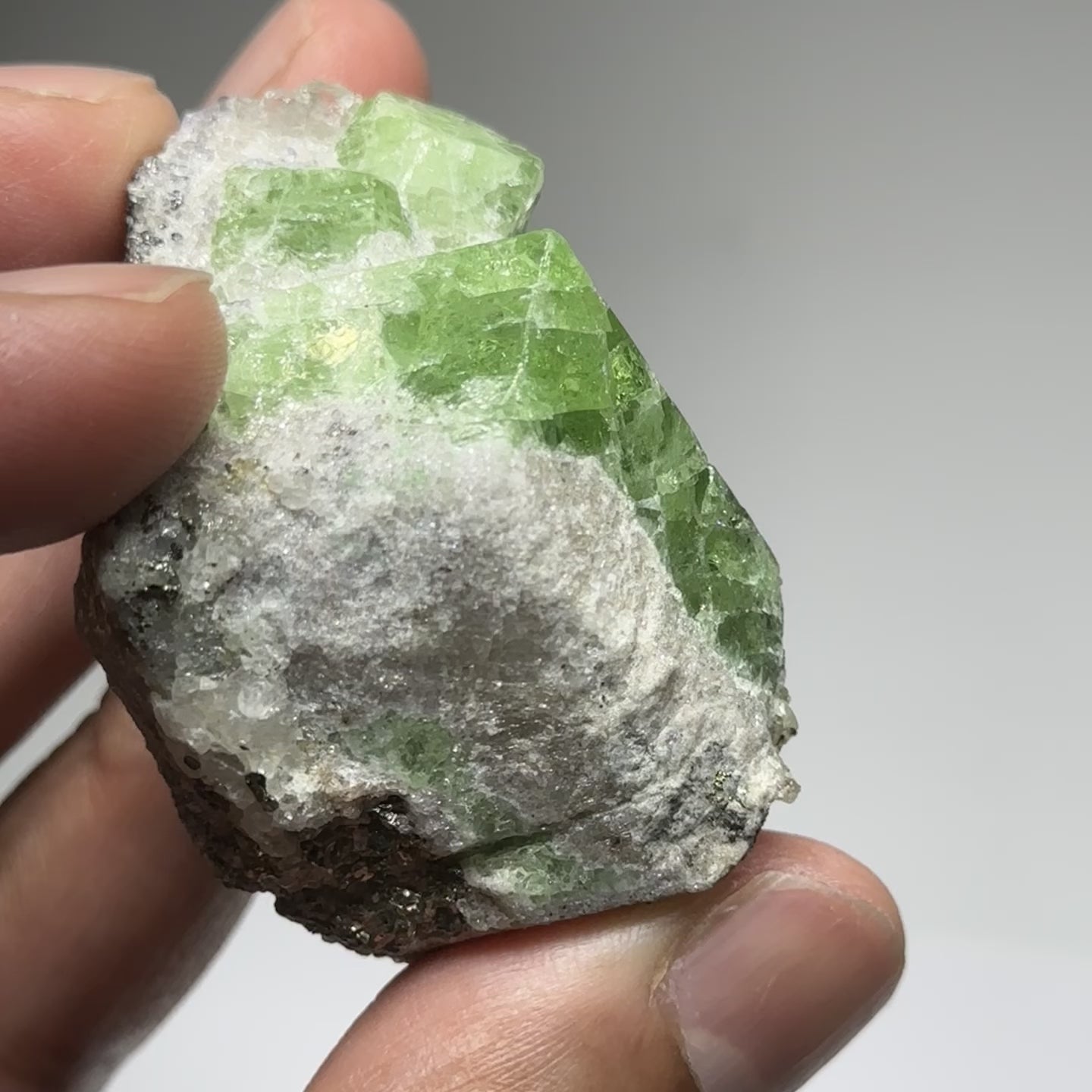 Tsavorite Crystal With Tanzanite And Pyrite on Matrix, 84.30gm / 421.50ct, Merelani, Tanzania. 47 x 36 x 39mm Gem portions and sharp point on crystals