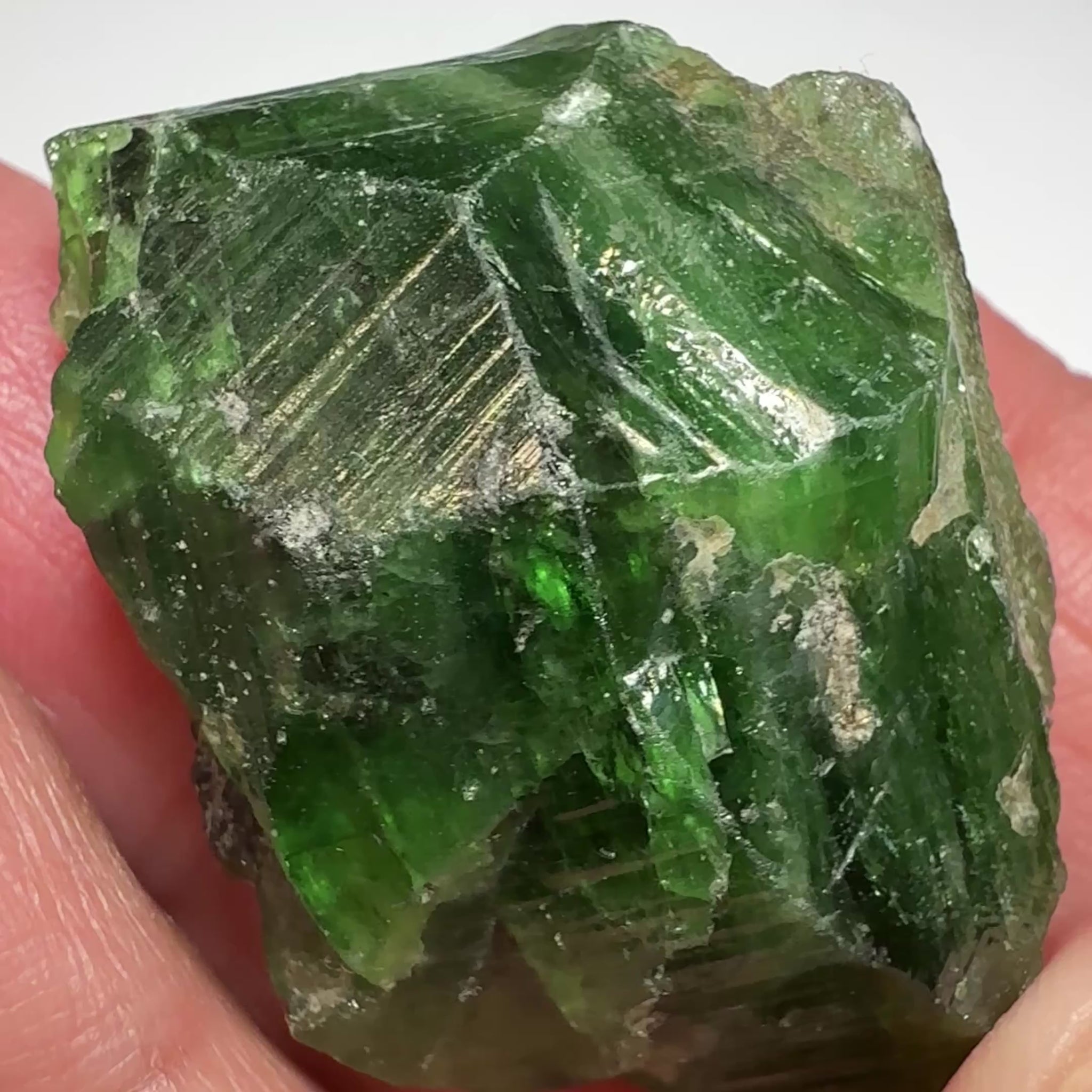 Tsavorite Crystal, 19.90gm / 99.50ct, Merelani. Tanzania, only the front is crystalized, but make a great specimen or set it in jewellery as is