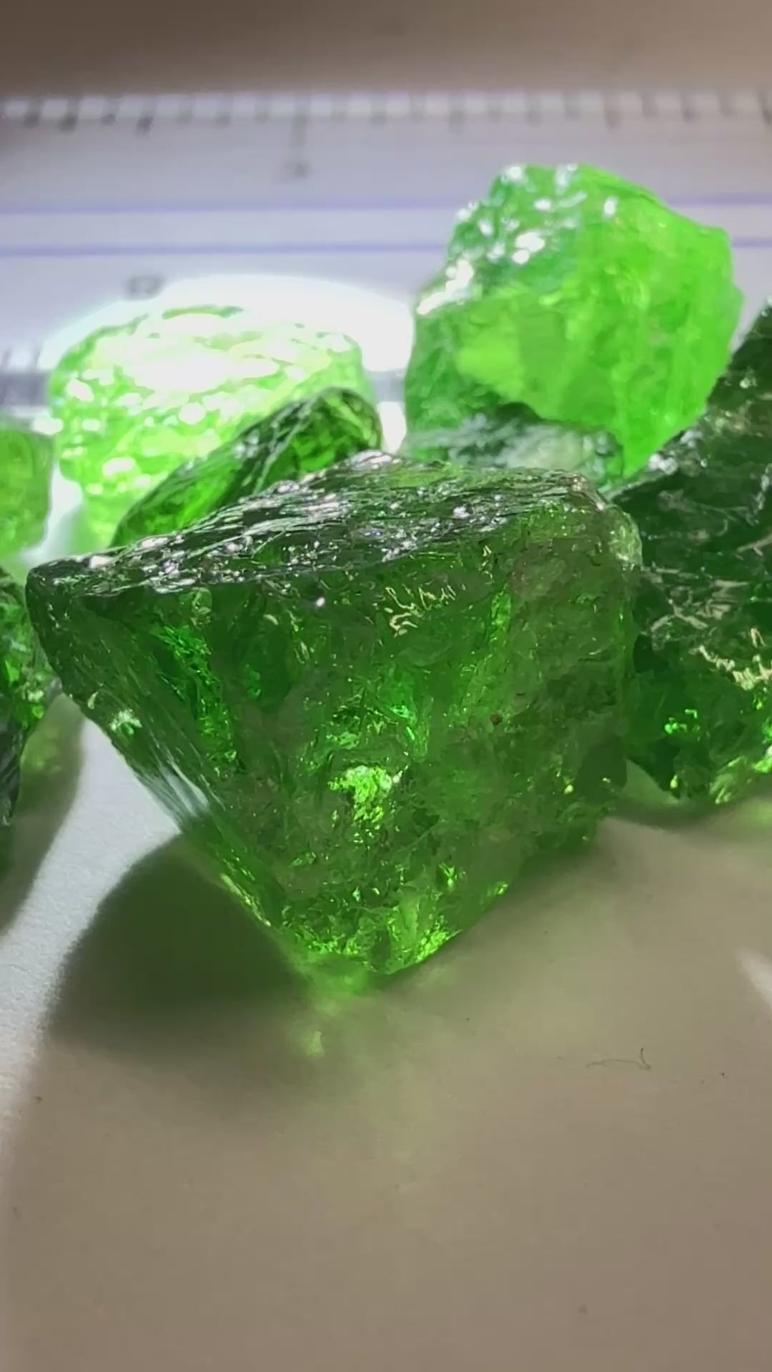 Tsavorite Lot, 61.75ct, Tanzania, Untreated, Unheated, this lot has veils and some pieces require some cobbing, if you know tsavorite you know what I’m talking about, many of the veiled, you can cut as is. See the videos for clarify magnification