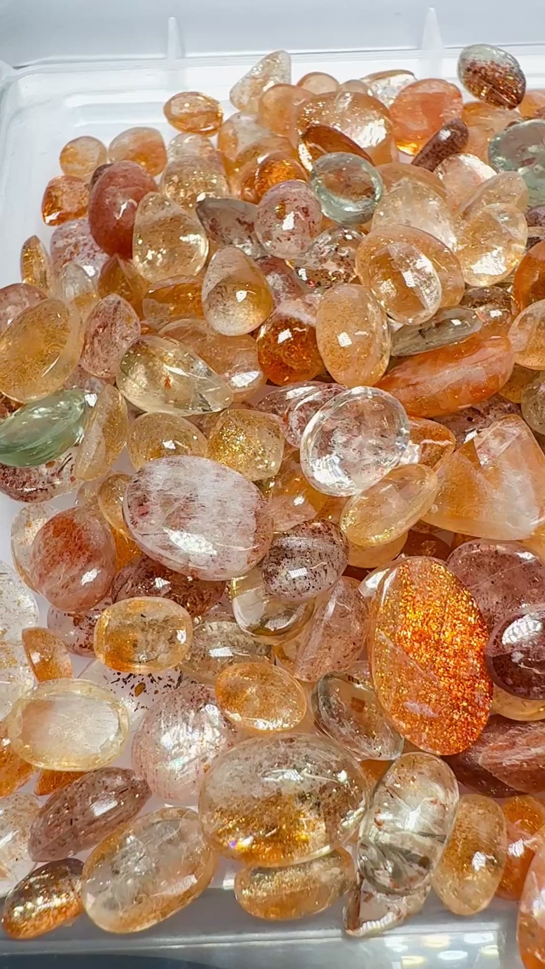 Wholesale Sunstone Cab Lot, flat backed cabs, 228gm / 1140ct, Comminly called Maasai Confetti Sunstone, Tanzania, Untreated Unheated, photos and vids in different lights, see how they look