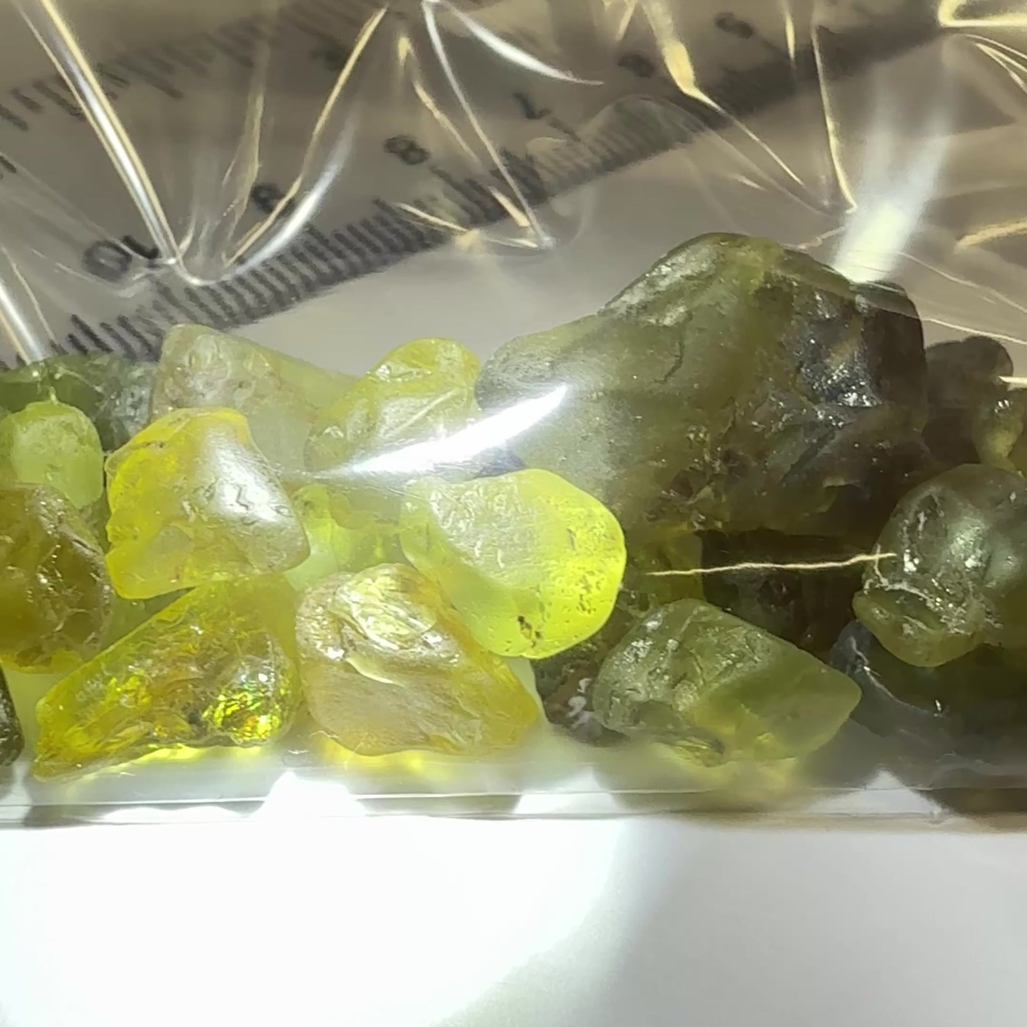 Chrysoberyl lot, 190.09ct, Tunduru, Tanzania, Untreated Unheated. A mix between faceting grade and cabbing grade rough, they change colour but only very very slightly, see video showing the different lights