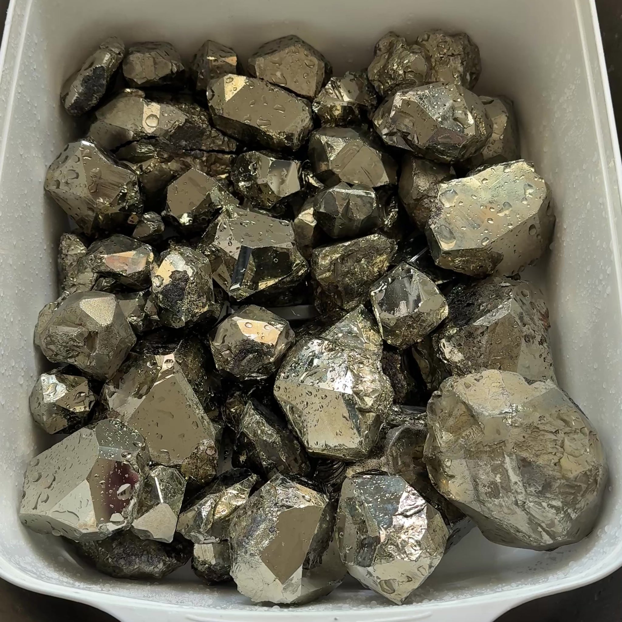 Mirror Shine Pyrite Lot from Merelani Tanzania. These that come from Merelani, show a high, natural mirror finish on the facets, without polishing, these have come out of the ground like this, shown wet, they can be faceted, the lot is 11.10 kilo
