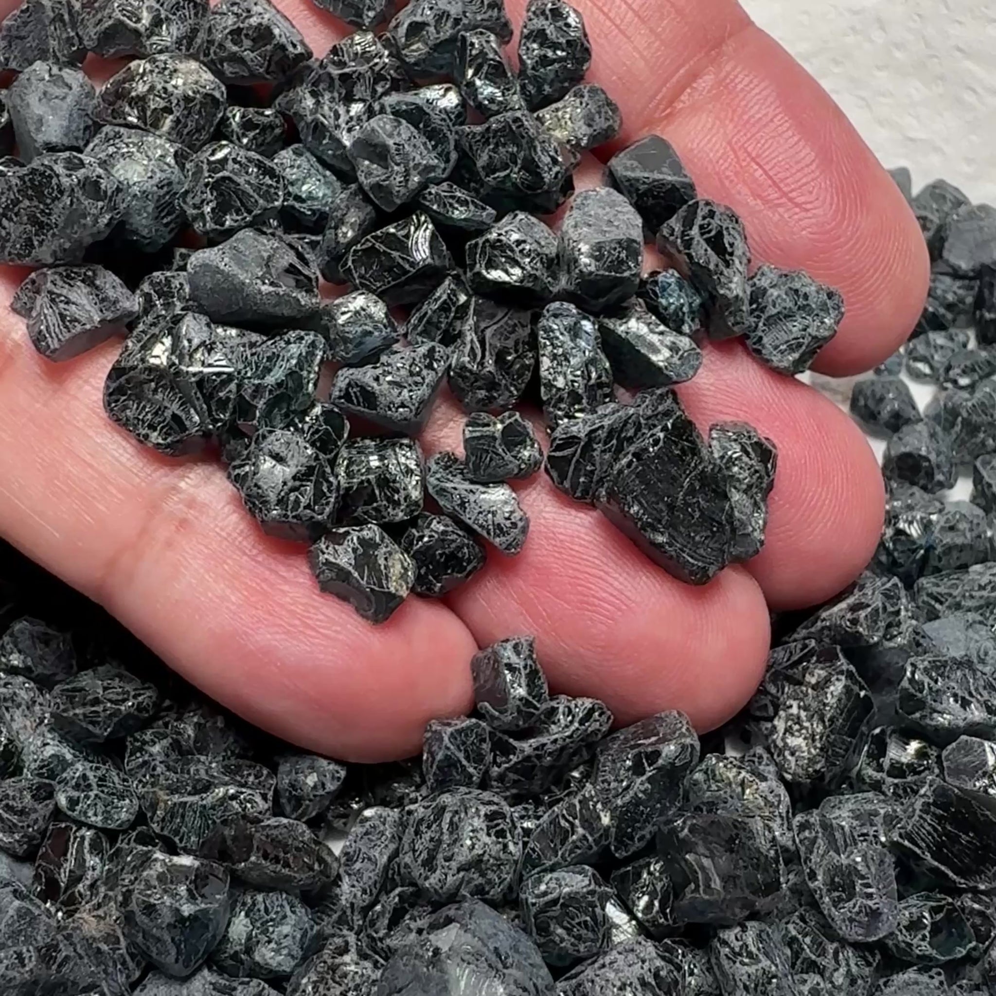 Midnight Blue Spinel Lot, 309.70gm / 1548.50ct, Mozambique, Untreated Unheated. All transparent stones, midnight blue but dark in normal light. See both videos. Almost all are vvs. Not sure if heat will lighten it. 3ct-11ct